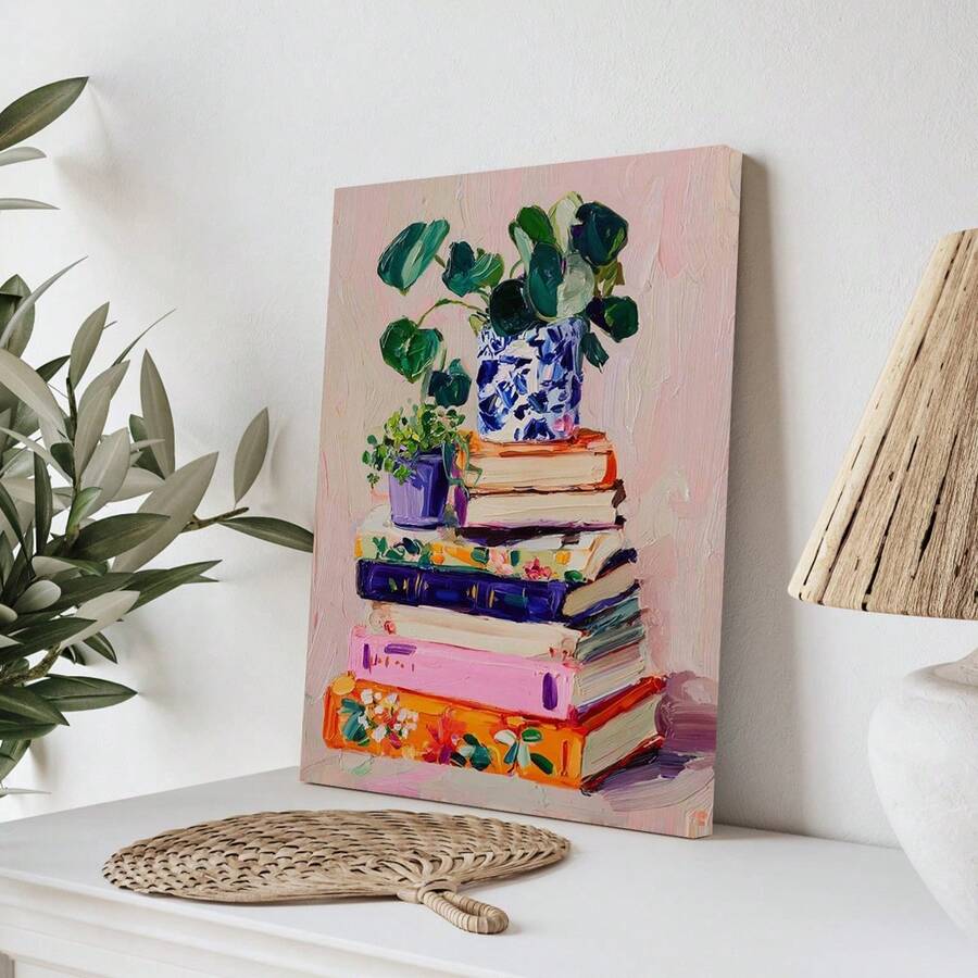Unframed stacked books and leafy plants canvas on white console