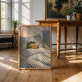 Frog reading in bed canvas leaning in sunlit plant-filled room