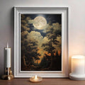 Moonlight forest night sky landscape poster in white frame beside candles and lamp