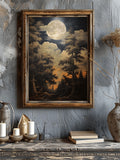 Framed vintage moonlit forest poster on blue wall above rustic console with candles books and vase