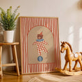 Framed circus bear artwork beside a rocking horse in a kids room