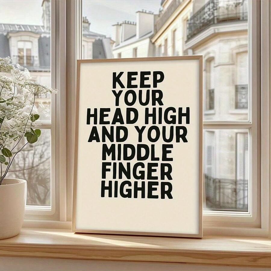 Tan frame display of cheeky confidence quote wall art on a sunlit window sill