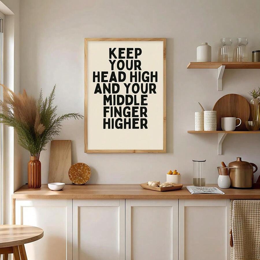 Honey wood frame display of funny attitude wall art in a bright kitchen vignette