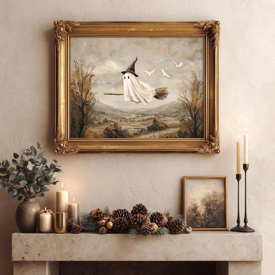 Ornate gold framed ghost on broom canvas above candlelit autumn mantel
