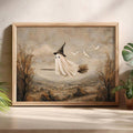 Light wood framed witch ghost poster styled with green houseplants