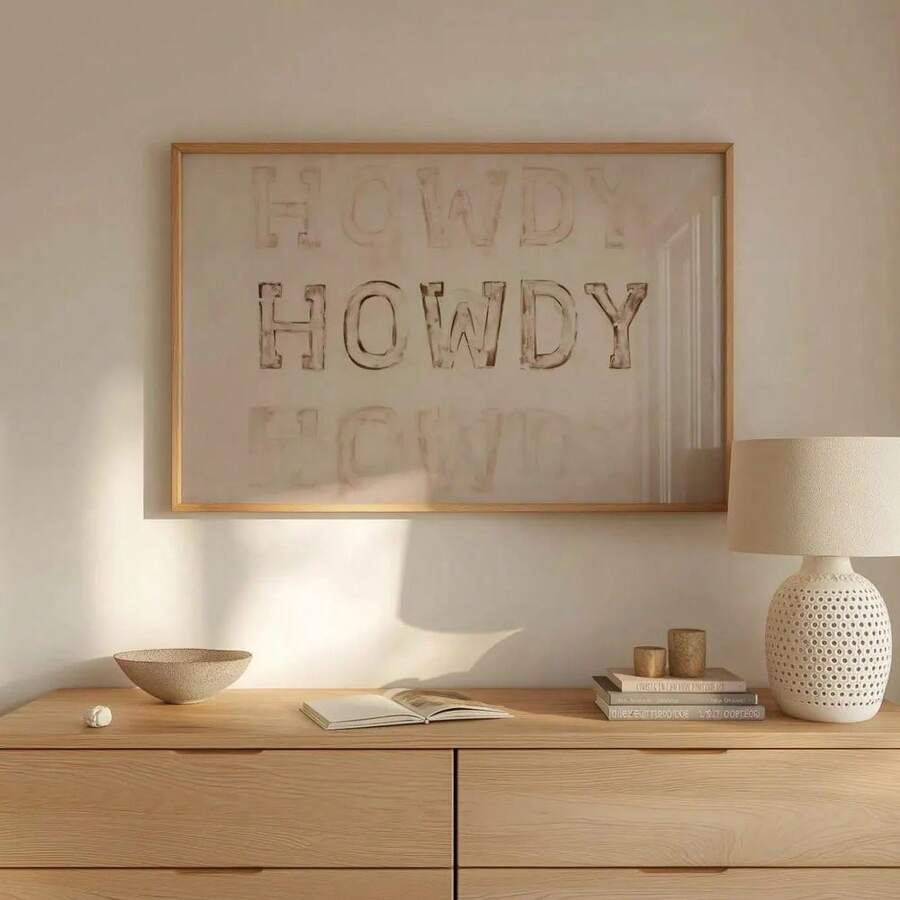 Framed western typography print above wood table
