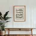 Retro-modern quote artwork above a turntable