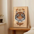 Tiger poster with Go Get Em text on bedside table