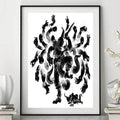 Black framed Buddhist deity poster centered between white vases and orchids