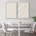 Tan white abstract canvas set above dining nook