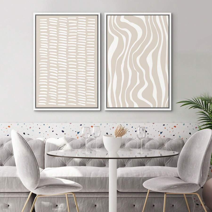 Tan white abstract canvas set above dining nook