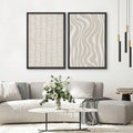 Beige geometric wall art pair above light sofa