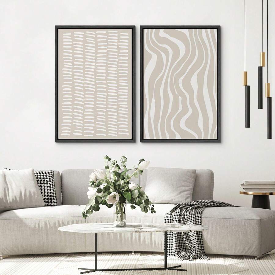 Beige geometric wall art pair above light sofa