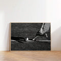 Soccer player kicking ball poster on wood floor