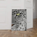Frameless leopard face canvas on wood floor