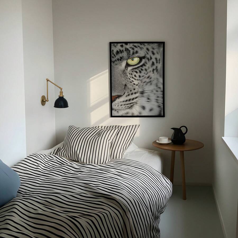 Leopard eye wall art above striped bed