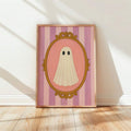 Retro pink ghost portrait poster leaning against a white wall