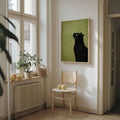 Vertical framed cat wall art in a bright residential interior
