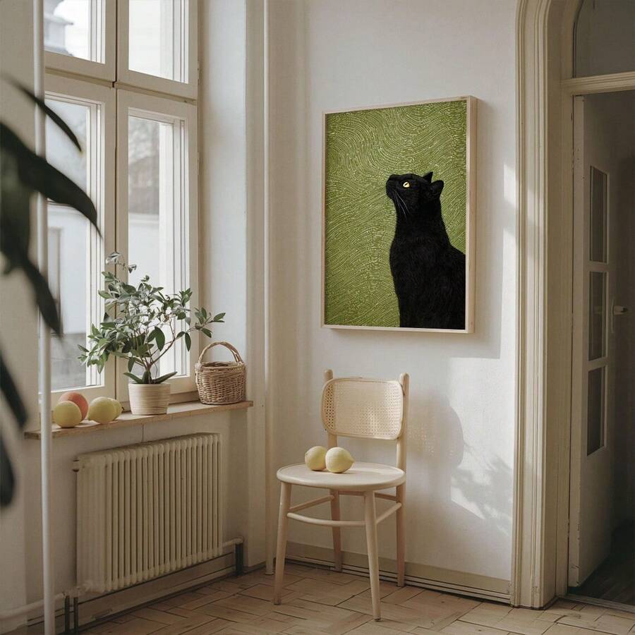 Vertical framed cat wall art in a bright residential interior
