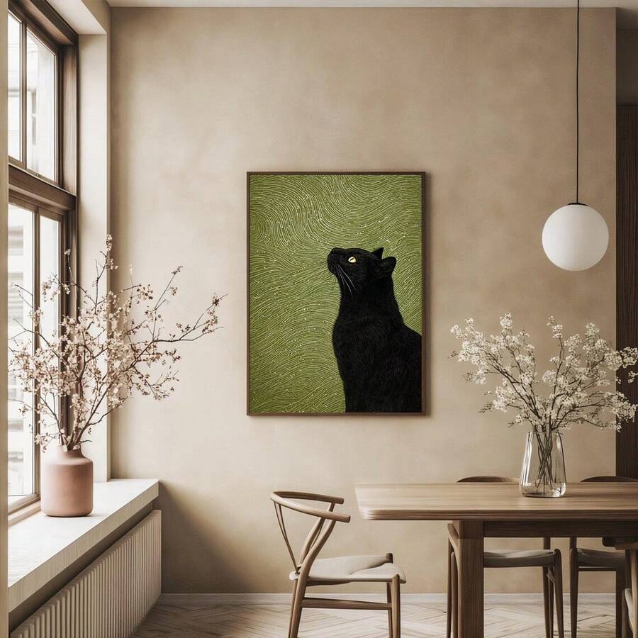Black cat artwork in natural wood frame displayed in a dining room