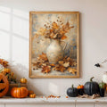 Gold framed autumn pitcher and maple leaves poster above Halloween pumpkins and black gourds