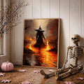 Framed witch with fire wand poster leans beside skeleton in autumn Halloween room