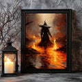 Witch holding flame wand poster in black frame beside lantern candle and bare branches