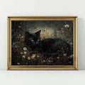 Gold framed black cat wildflower meadow poster on white background with moody dark floral painting style