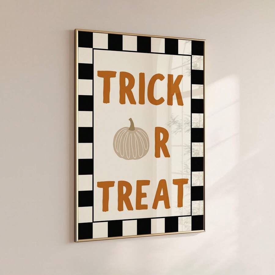 Wall mounted Trick Or Treat Halloween poster in slim gold frame with orange text pumpkin icon and black checker border