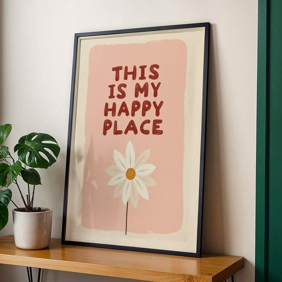 Black framed Happy Place poster on shelf