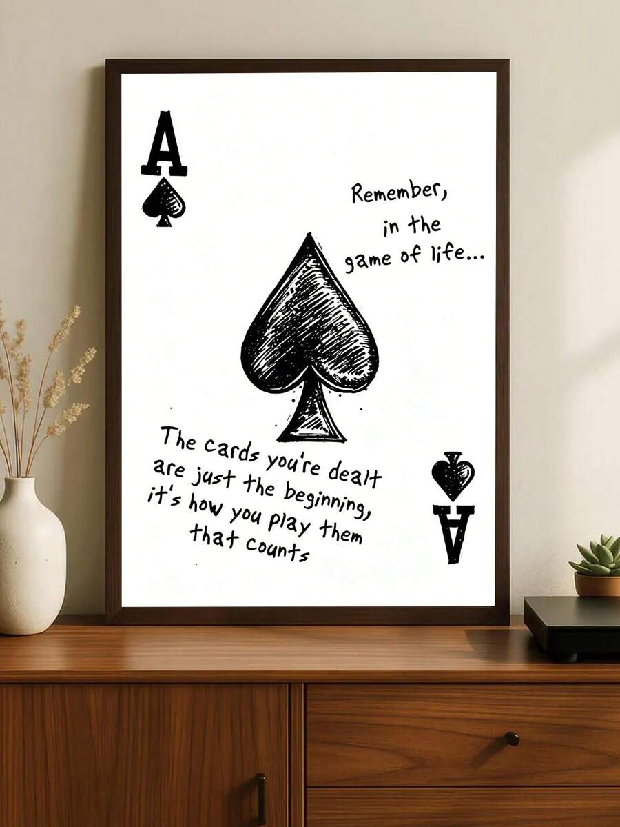 Framed ace of spades motivational poster on wood cabinet with black hand drawn spade and game of life quote