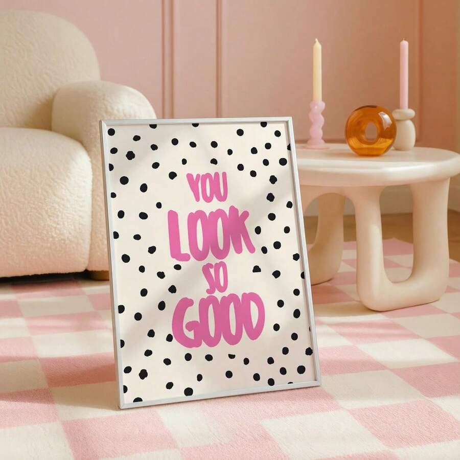 Playful pink wall art displayed with a green table lamp