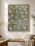 Blue gray bird wall art styled in a bright bedroom with a bench