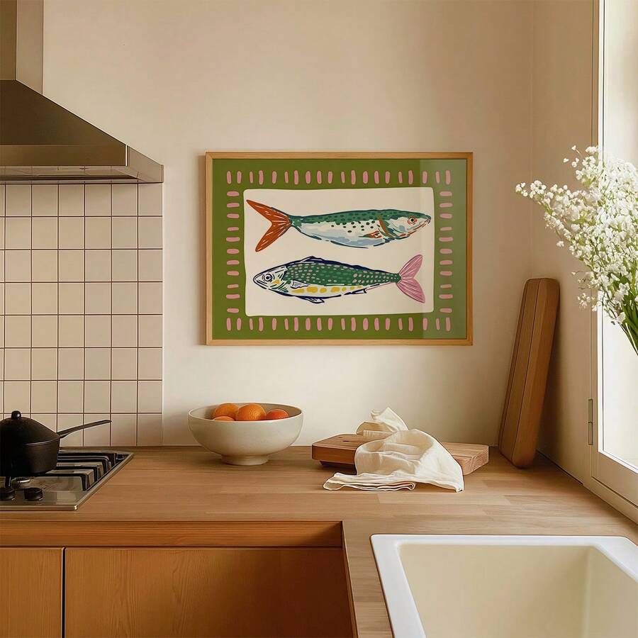 Horizontal two-fish wall art mounted above wood counter in modern neutral kitchen