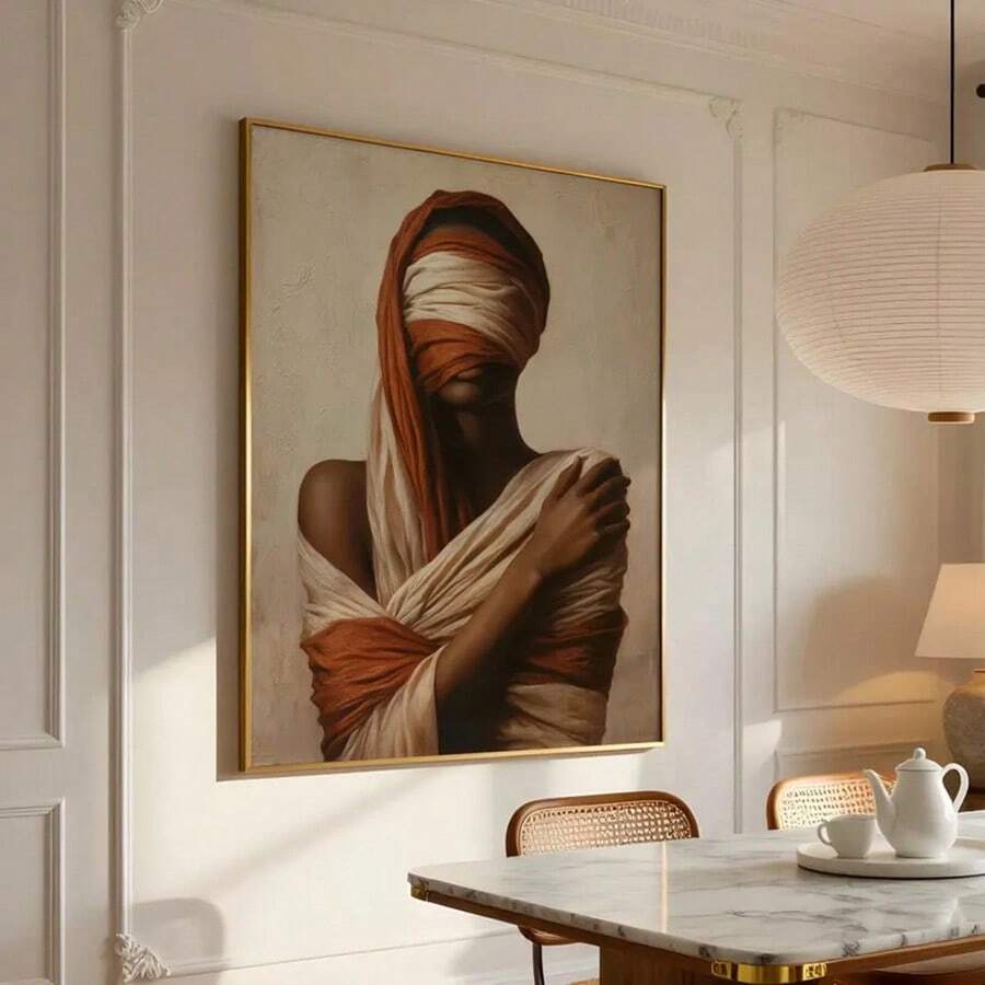 Framed portrait of draped figure in rust and ivory cloth on sunlit wood floor