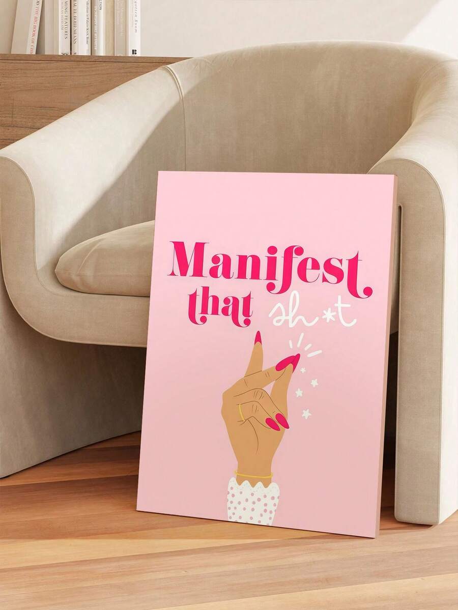 Unframed pink Manifest affirmation poster styled beside a chair
