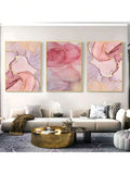 Pink and lavender abstract marble triptych wall art above modern living room sofa