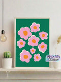 Pink flower canvas poster in light wood frame beside cactus and pendant bulb