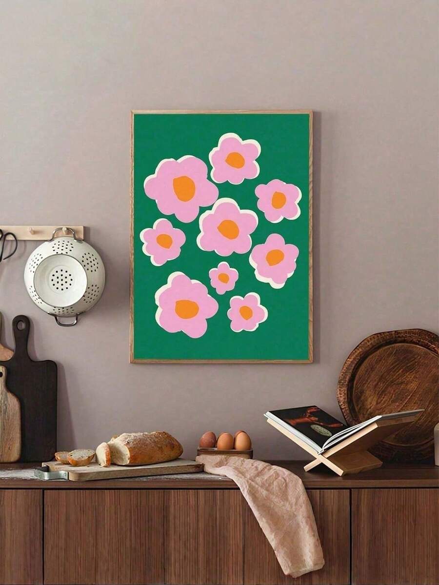 Framed pink and green floral wall art above rustic dining counter