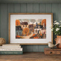 Rustic framed pumpkin village artwork styled above a mantel