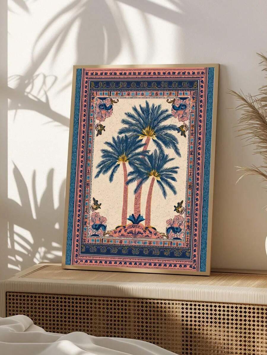 Cream and blue palm tree wall art with ornate pink border displayed on cane-front console