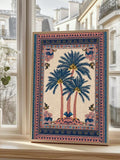 Cream tropical poster with three blue palm trees and layered pink navy ornamental border beside window