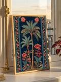 Gold-tone framed tropical palm tree poster with teal leaves and coral flowers on sunny window sill
