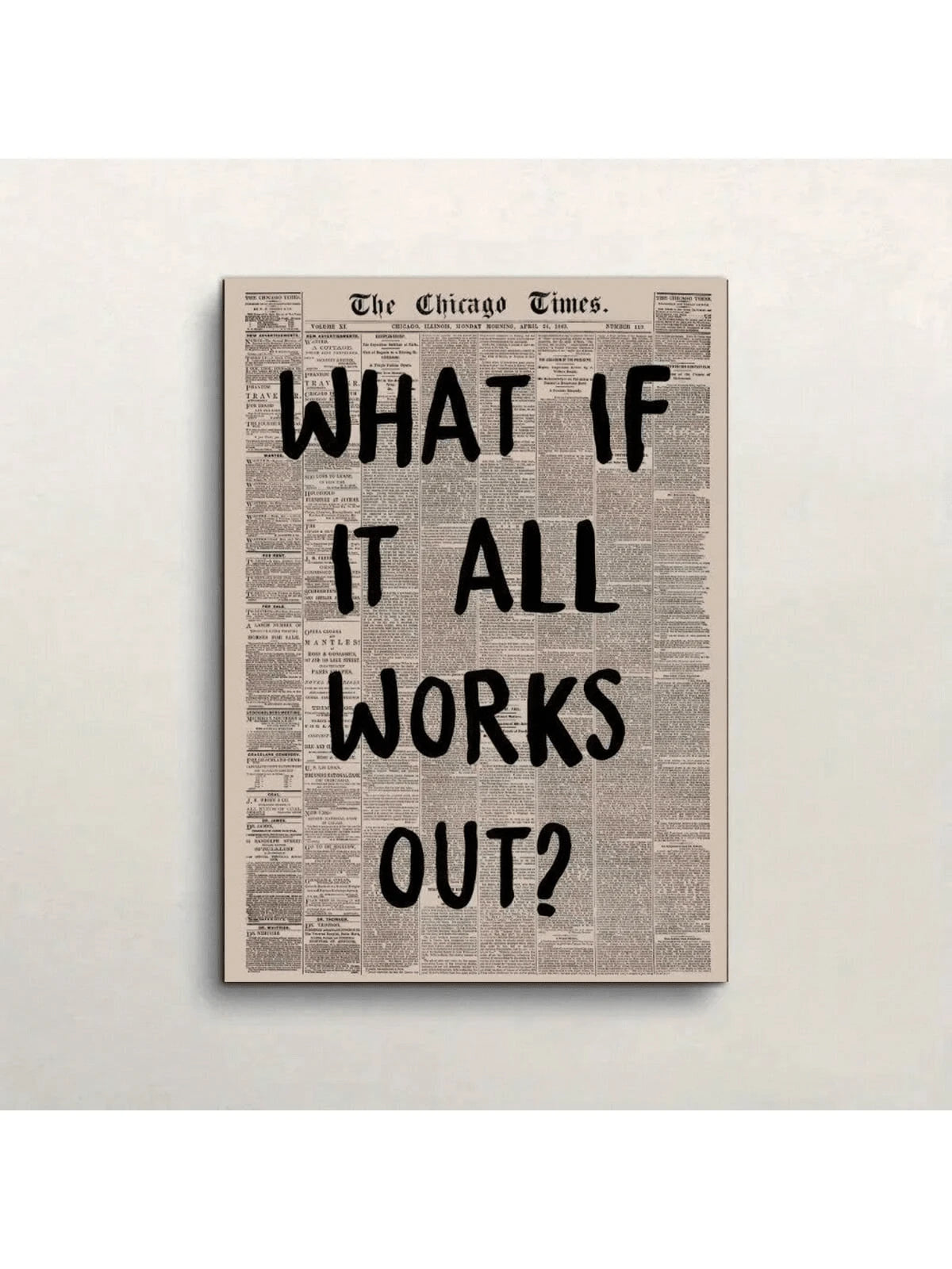 Vintage newspaper quote canvas reading What If It All Works Out on a plain wall