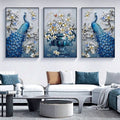 Three blue peacock and vase floral prints above white sectional sofa in modern living room