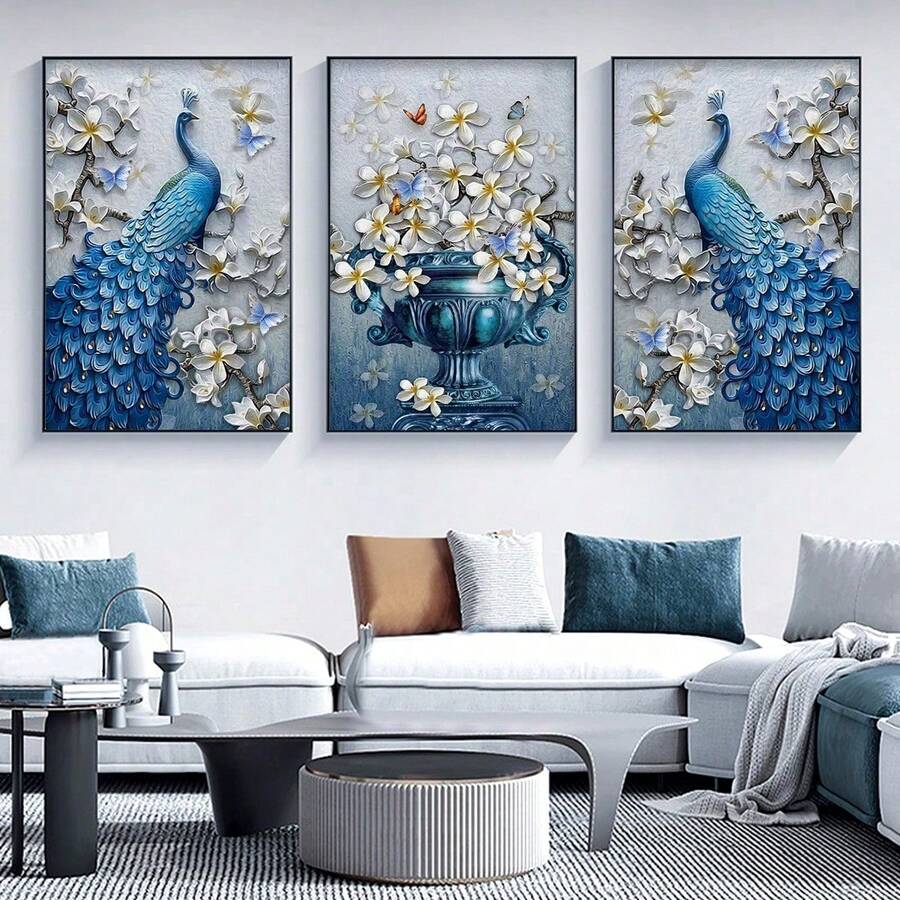 Three blue peacock and vase floral prints above white sectional sofa in modern living room