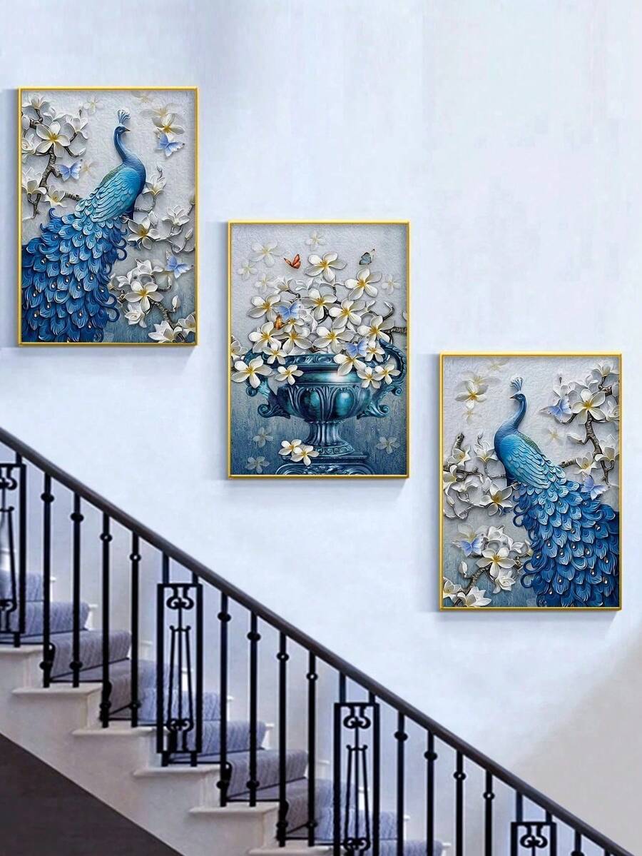Three gold framed blue peacock and floral vase prints displayed along staircase wall