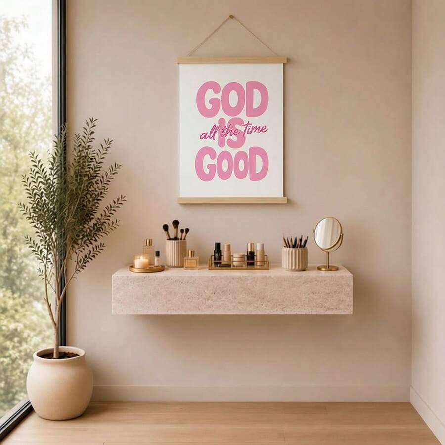 Pink God Is Good Christian quote print in white frame on styled shelf