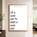 Minimalist black and white good day quote poster hanging on wall