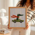 Person holding framed crocodile convertible artwork in a bright living room